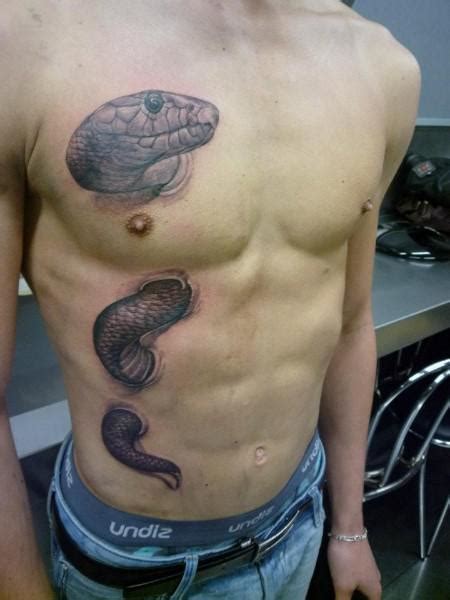 Mesmerizing snake stomach tattoos that slither with style